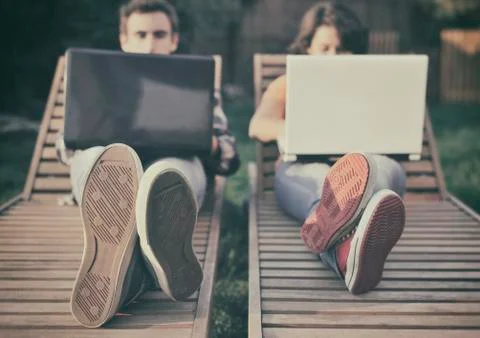 Couple working on laptop Stock Photos