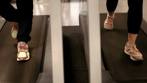 Couple working out side by side together on treadmills. Stock-Footage 88374783