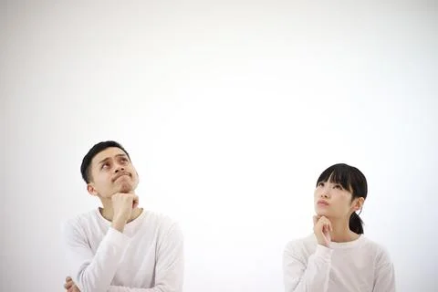 Couple worried while looking up Stock Photos