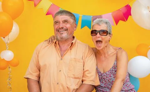 Couple on yellow background Stock Photos