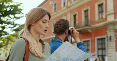 Couple of young Caucasian tourists having sightseeing tour and looking around Video stock 139504341