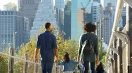 Couple With Young Daughter Walking On Footbridge, Back View Stock Footage