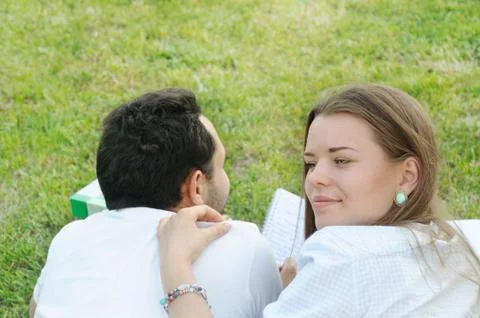 Couple of young students studing outside in the park Stock Photos