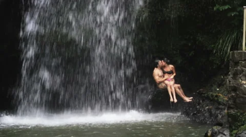 Couple/Man under waterfall Stock Footage 999785
