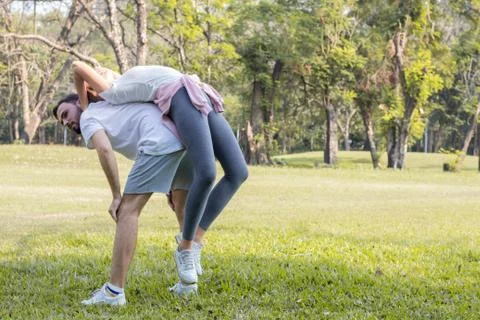 Couples are exercising in the park. Stock Photos