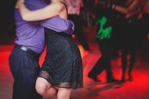 Couples dancing argentinian dance milonga in the ballroom, tango lesson in th Stock Photos