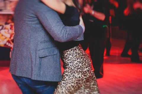 Couples dancing argentinian dance milonga in the ballroom, tango lesson in th Stock Photos