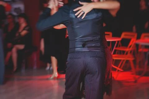 Couples dancing argentinian dance milonga in the ballroom, tango lesson in th Stock Photos