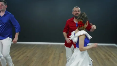 Couples dancing bachata together in studio, playful celebration Video stock 337216726