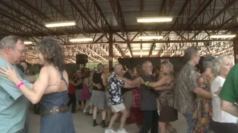 Couples dancing past camera Stock Footage 11151598