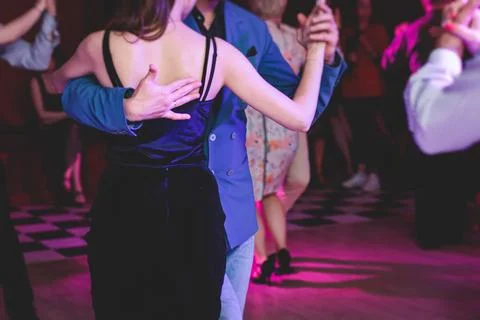 Couples dancing traditional latin argentinian dance milonga in the ballroom.. Stock Photos
