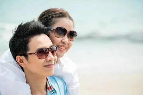 Couples dating at beach Stock Photos
