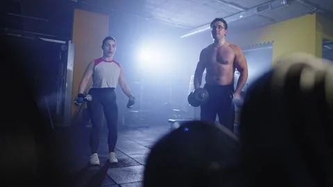 Couple's Gym Workout: Dumbbell Training for Strength and Fitness. Stock Footage 242664226