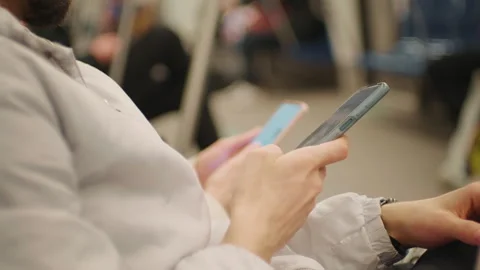 Couples hands close up using smartphone on the subway. Stock Footage 295768938