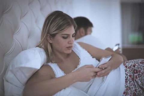 Couples issues with technology addiction Stock Photos