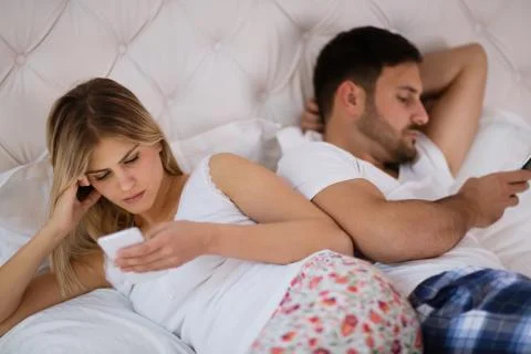 Couples issues with technology addiction Stock Photos