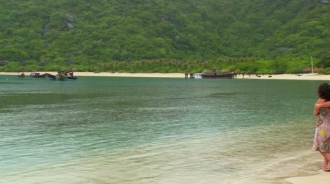 Couples looking at view from beach in Asian Island Stock Footage 54591459