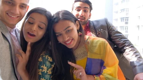 Couples pose with their friends for fun and smiling selfies on their mobile phon Stock Footage 101225221