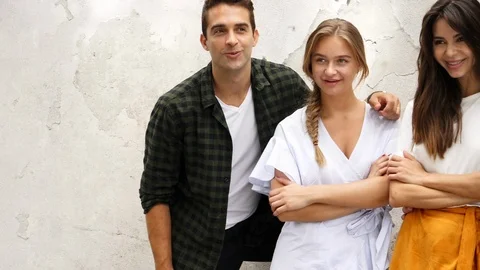 Couples posing by wall 스톡 동영상 93836480