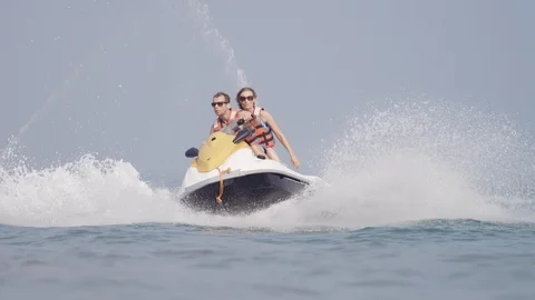 Couples riding on jet ski. Stock Footage 119396444