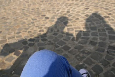 Couples Shadow In A Bench Stock Photos
