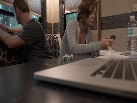 Couples Sit in 5th Wheel RV Relaxing While Camping Stock Footage 80539860