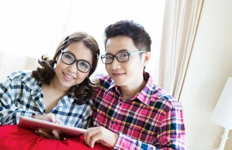 Couples with tablet Stock Photos