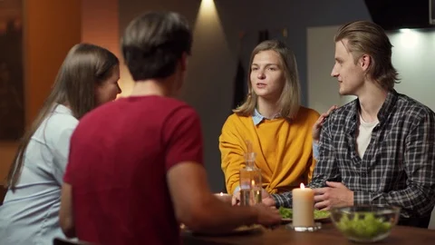 Couples talking and laughing at dinner Stock Footage 114813313