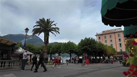 Couples walk along the dockside in Bellagio, Lake Como Stock Footage 318312178
