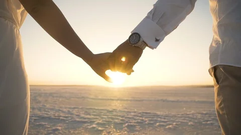 Couples walking hand in hand at sunset Video stock 114288831