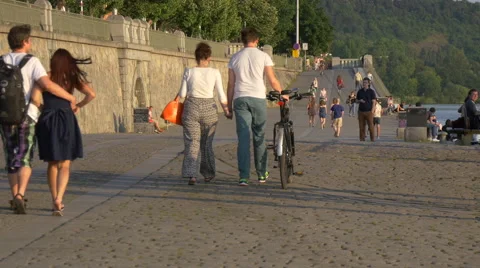 Couples walking on the waterfront in Prague Stock Footage 56233435