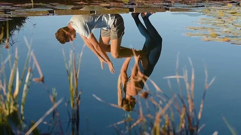 Couples yoga outdoors Stock Footage 76521649