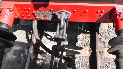 Coupling bolt in sunlight behind steam moving locomotive (Tanfield Railway) Video stock 87685671