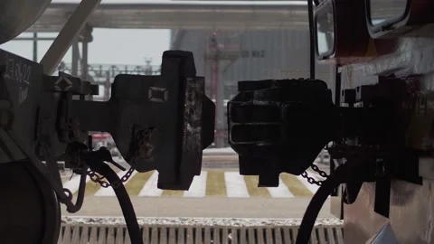 Coupling of the coupling of a railway freight car with a shunting locomotive. Video stock 212382532