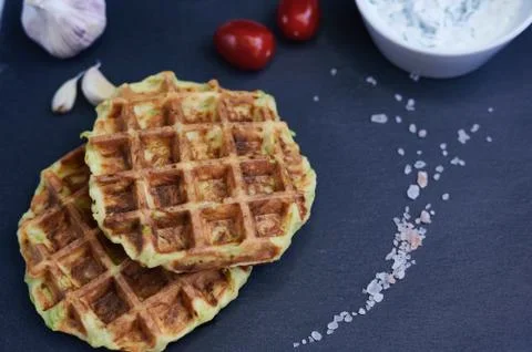 Courgette waffles close up on a stone background with Himalayan salt Foto stock