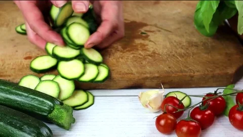 Courgettes sliced with cherry and herbs Fresh zucchini with  basil Video stock 108970691