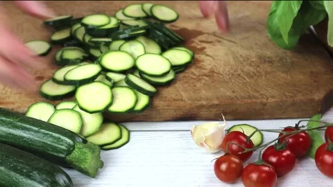Courgettes sliced with cherry and herbs Fresh zucchini with  basil Video stock 108970696