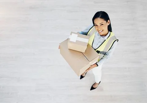 Courier, boxes and portrait of delivery woman from above for logistics, cargo or Stock Photos