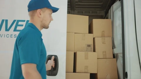 Courier Closes Side Door of the Delivery Van that is Full of Cardboard Boxes Stock Footage 116091309