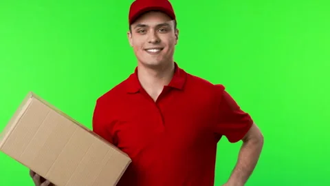 Courier coming in with parcel and smiling at camera Video stock 276365452