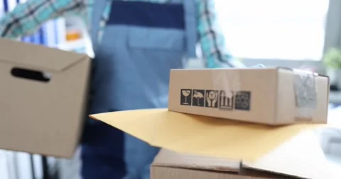 Courier delivery man hands over boxes with parcels 스톡 동영상 281365500