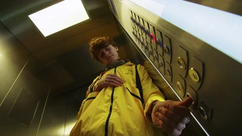 Courier in the elevator Stock Footage 236897885