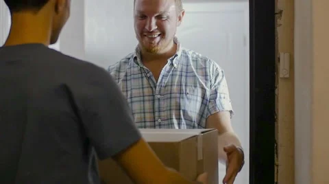 The courier gave a parcel to the customer Stock Footage 58056555