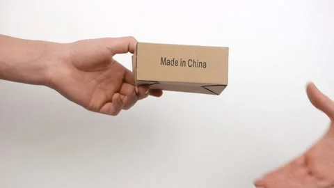 Courier handing over the parcel to the client on a white Stockbeeldmateriaal 150331954