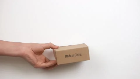 Courier handing over the parcel to the client on a white Stockbeeldmateriaal 150332013