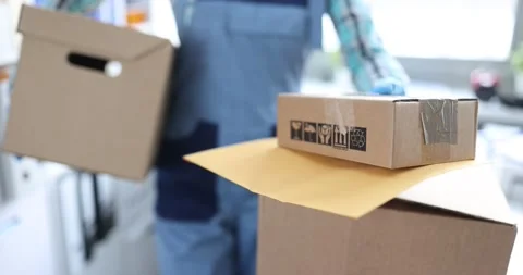 Courier hands over box with parcel closeup 스톡 동영상 169080519