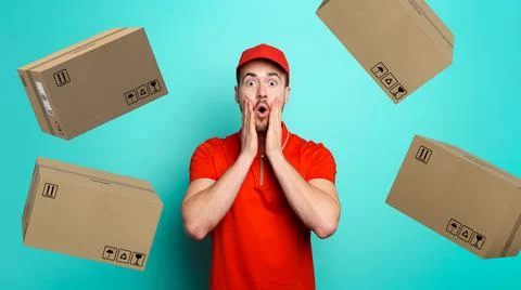 Courier has a wondered expression about a great promotion with falling packages Stock Photos