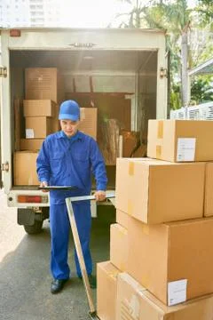 Courier loading van Stock Photos
