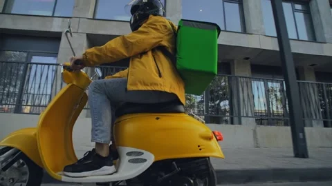 Courier man food backpack. Guy ride scooter deliver products. Delivery service. 動画素材 281553525