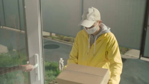 Courier Man Wearing Face Mask And Rubber Gloves Delivery Service 動画素材 141772014